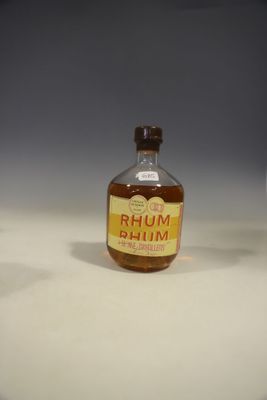 a small bottle of rum sitting on a table