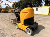 a yellow machine that is sitting in the dirt