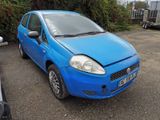 a small blue car parked in a parking lot