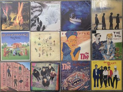 a lot of posters on the wall of a room