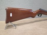 the rifle is sitting on the table ready to be used