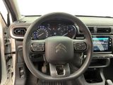 the interior of a car with a steering wheel and dashboard controls