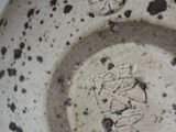 a close up view of a bowl with writing on it