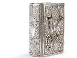 an image of a silver cigarette case with a design on it