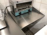 a toaster oven sitting on a counter in a kitchen