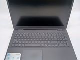 an open laptop computer sitting on top of a white table