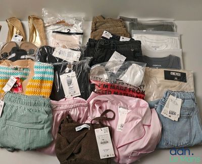 many different types of clothing on display in a box