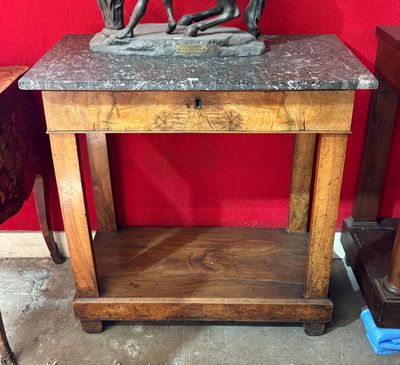 a statue of a man riding a horse on a table