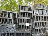 many crates stacked on top of each other in the woods