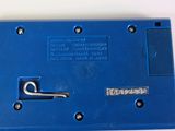 a close up of a blue device on a white surface