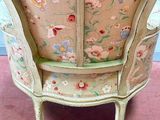a chair with a floral pattern on the back of it