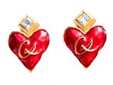 pair of red heart shaped earrings with gold accents on white background