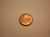 three coins on the table next to each other
