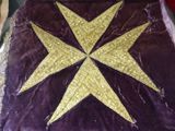 a purple blanket with a gold star on it