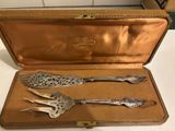 two spoons and a fork in a case