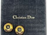 Boucles d'oreilles Christian Dior dans leur boîte
