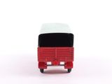 a small red bus with a white top on a white surface