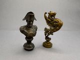 pair of antique bronze figurines of a man and a dragon