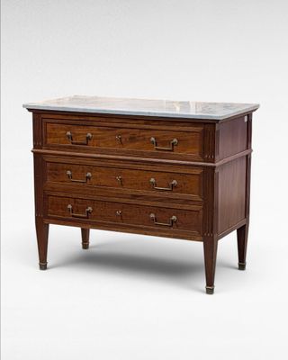 an image of a chest of drawers with marble top