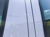 a dog that is sitting in the passenger seat of a car
