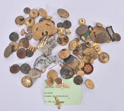 a pile of old buttons and buttons on a white surface