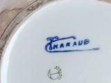 a close up of a plate with a blue and white design on it