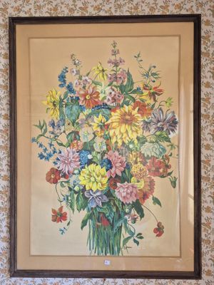 tableau représentant un bouquet de fleurs dans un vase accroché au mur