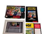 three nintendo games in a box on a white surface