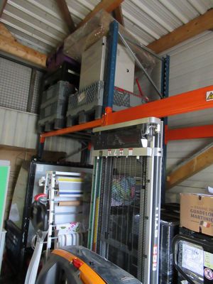 a garage with a lot of items on the shelves