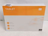 an orange and white box of a tablet on a white surface