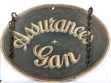 a sign that says assistance can hanging on a chain