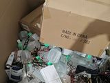 a cardboard box filled with assorted items in a room