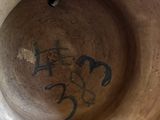 a vase with a drawing on the inside of it