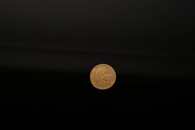 an image of a coin floating in the water on a clear day