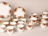 many different types of porcelain dishes and cups on the table