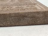 a close up of a stone block on a table