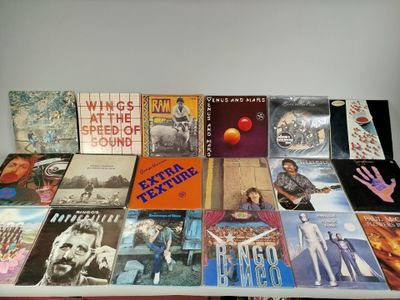 many different types of vinyl records on a table