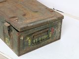 an old metal box that is sitting on a table