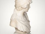 a white marble bust of a woman on a pedestal