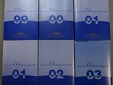 four boxes of cigarettes sitting on top of a table next to each other