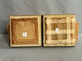 two pieces of wood that are sitting on a table