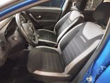 a blue car with black seats and a steering wheel
