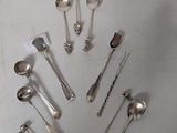 a lot of silver spoons and spoon spoons on a table
