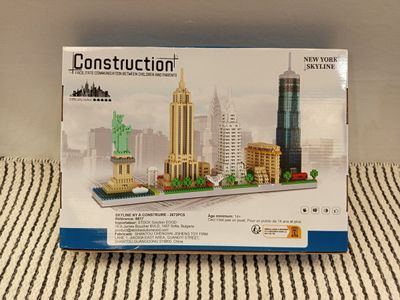 a box with a model of the statue of liberty on it