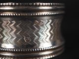 a close up of a silver cup on a table