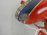 a red toy airplane with a blue and white stripe on it