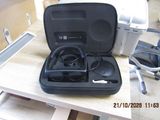 a black case with a pair of headphones in it