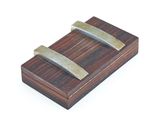 a small wooden box with two knives on it