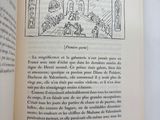 an open book with a picture of a man and a woman in a room