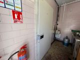a fire extinguisher next to a door in a kitchen